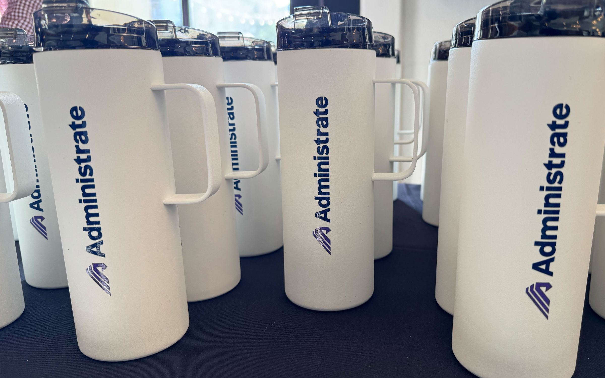 Photo of nametags with branded lanyards from a Customer Summit.