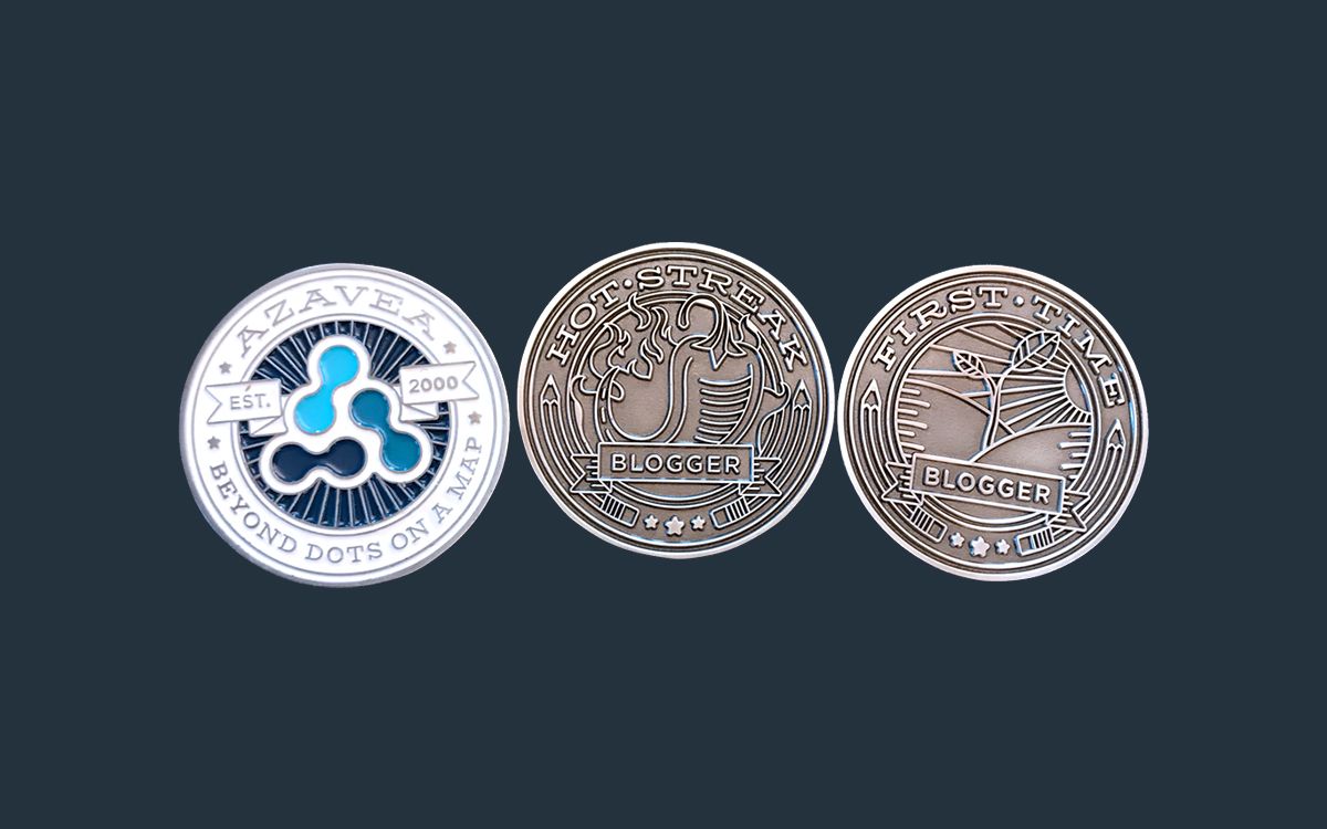 Three custom-designed challenge coins. The first one shows the back, which is in full color and contains the Azavea mark. The second two are the Hot Streak Award and the First Time Blogger Award.