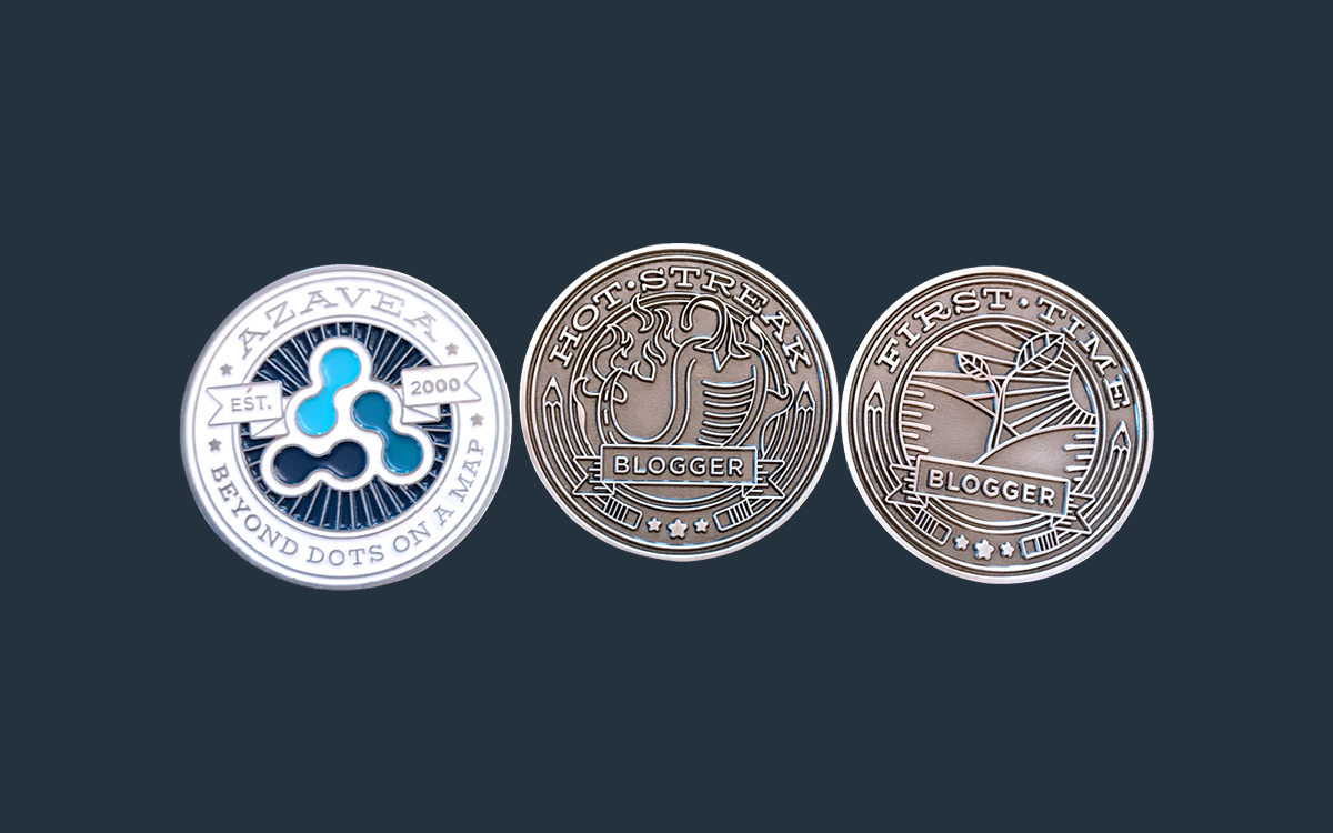 Three custom-designed challenge coins. The first one shows the back, which is in full color and contains the Azavea mark. The second two are the Hot Streak Award and the First Time Blogger Award.